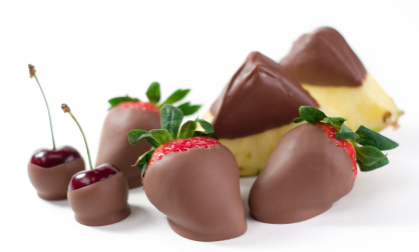 A variety of different types of chocolate-dipped fruit