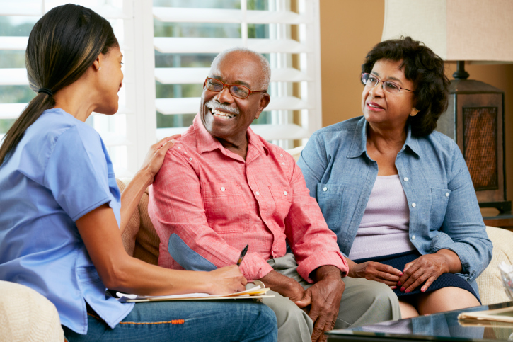 nurse making notes during home visit
