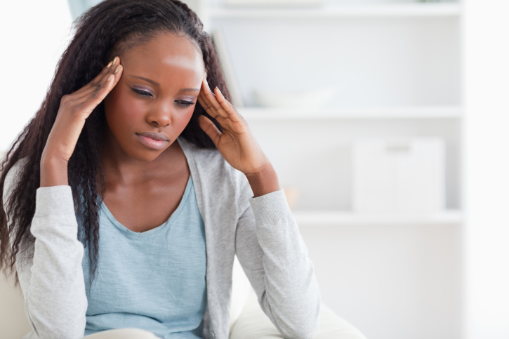 woman experiencing a headache