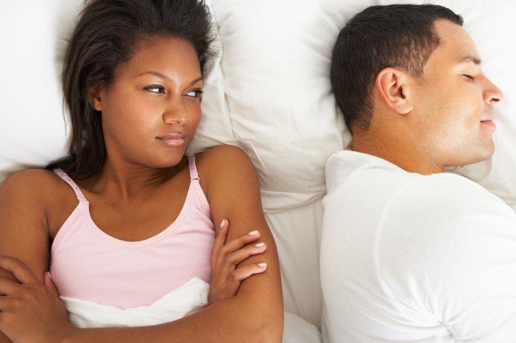 couple in bed upset