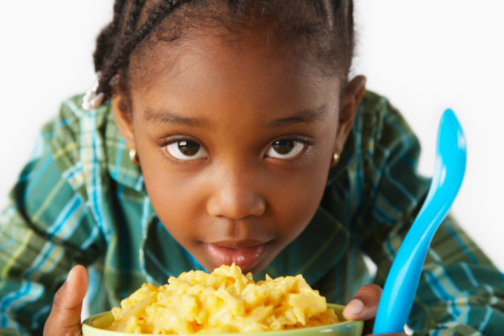 girl with macaroni and cheese