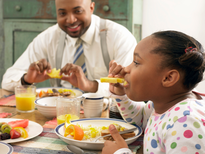 African american family having breakfast