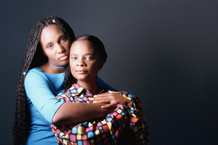 Mother and daughter hugging.