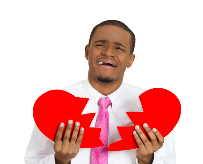 man holding broken heart