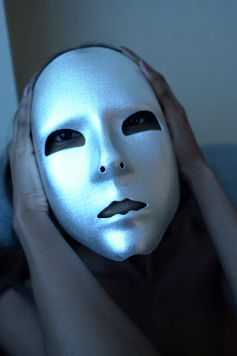 woman holding mask
