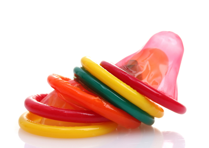 Colorful condoms isolated on white