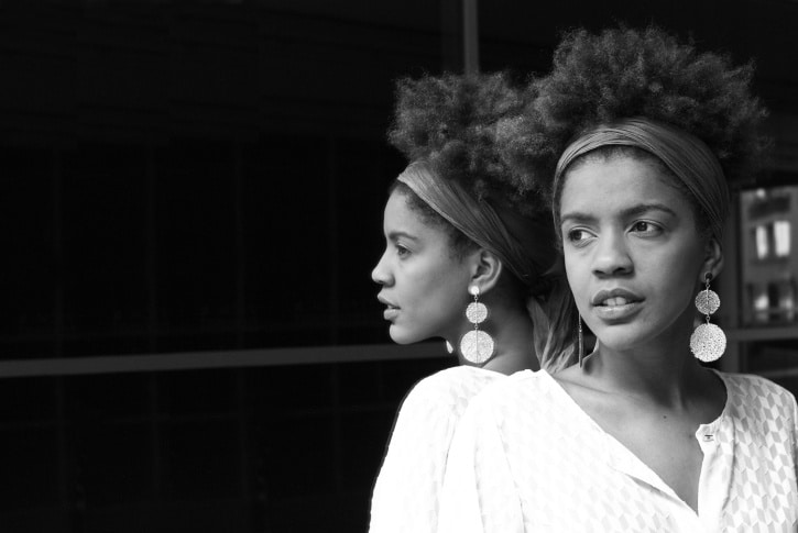 young african american woman on a mirror, black and white