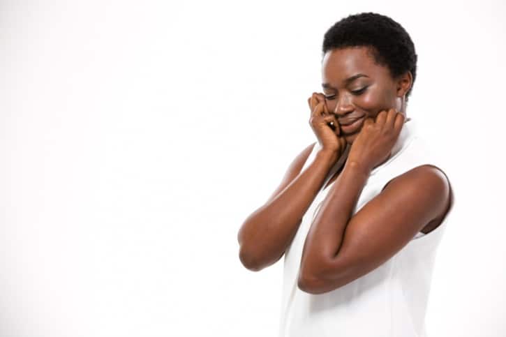 African american woman touching face