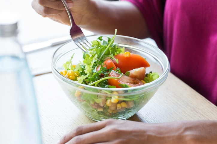 woman eating salad
