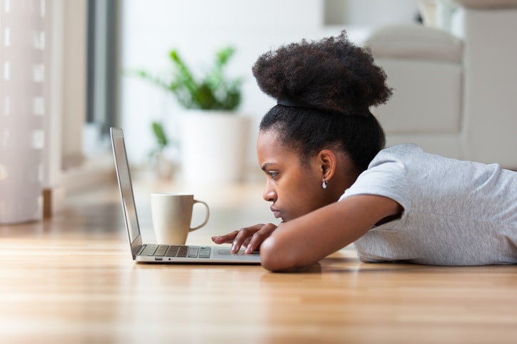 African American woman laptop sad serious