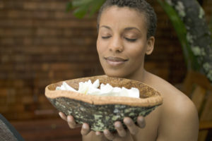 Woman closing her eyes and enjoying the smells. 