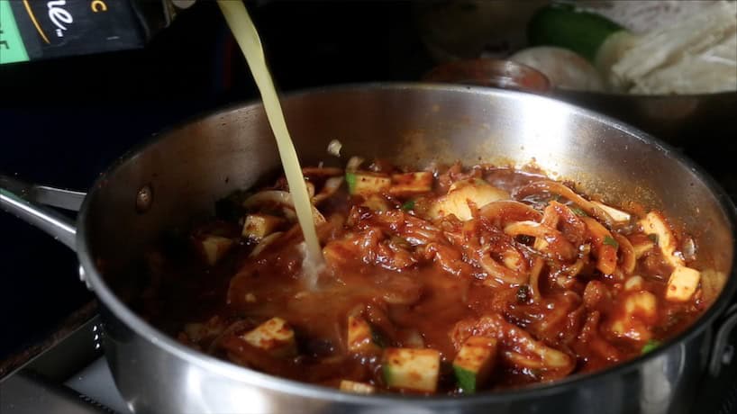 Kimchi Soondooboo Jeongol 6 Kimchi Soondooboo Jeongol, adding the broth
