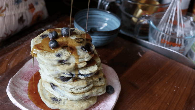 30-Minute Fluffy and Delicious Vegan Lemon Ricotta Pancakes. 34 Pancakes drizzled with maple syrup and garnished with fresh blueberries.