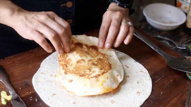Kimchi Crunchwrap Supreme 12 Adding the small tortilla to everything.
