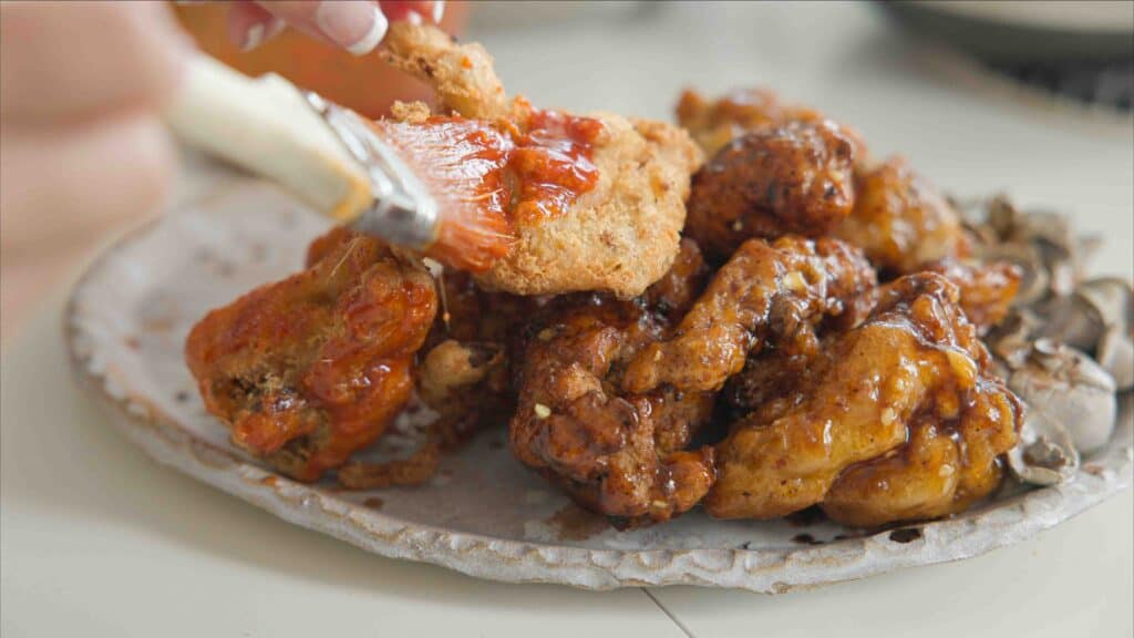 AMAZING Vegan Fried Chicken Recipe (2 Korean Sauces) 15 brushing sweet & spicy sauce onto vegan fried chicken