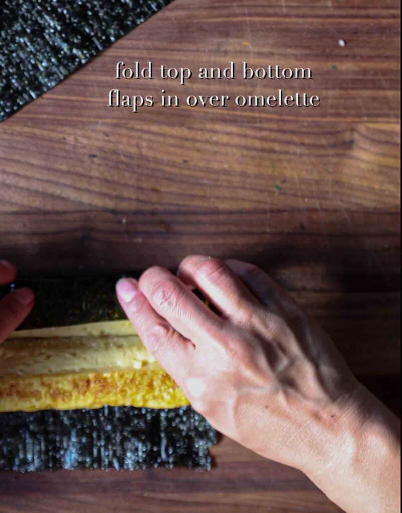 How to Make 4 Stunning Korean Kimbap Recipes. 32 Folding-top-flap-over-half-log-of-korean-omelet-for-heart-kimbap