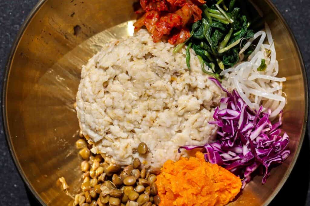 Easy Heart-Healthy Savory Oatmeal Recipe: Bibim Oats 5 Halfway done bibim oats with kimchi lentils sweet potato red cabbage spinach