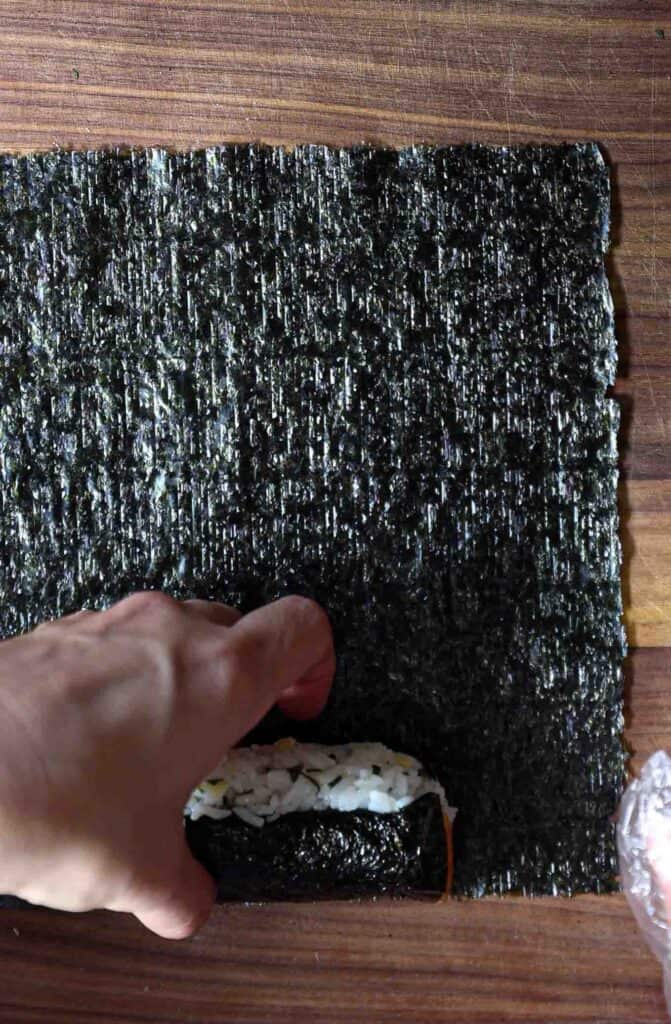 How to Make 4 Stunning Korean Kimbap Recipes. 38 Measuring-out-the-external-seaweed-sheet-for-heart-kimbap