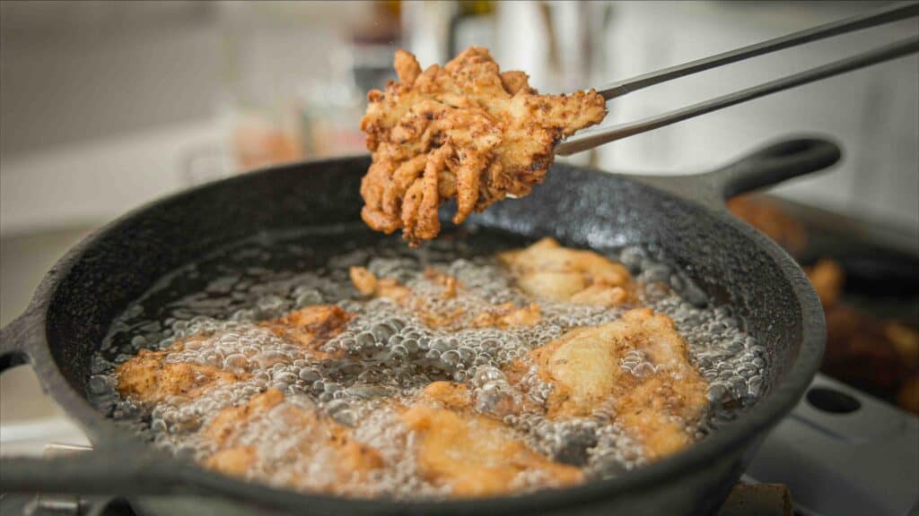 AMAZING Vegan Fried Chicken Recipe (2 Korean Sauces) 11 Piece-of-vegan-fried-chicken-coming-out-of-fryer
