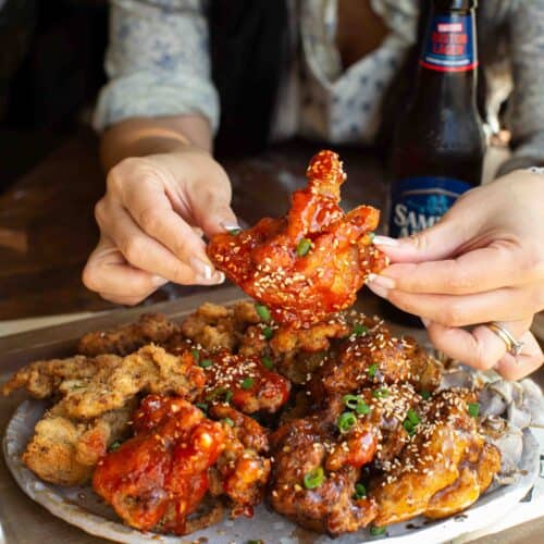 AMAZING Vegan Fried Chicken Recipe (2 Korean Sauces) 17 holding-vegan-fried-chicken-with-spicy-sauce