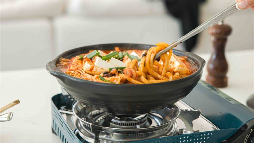 Easy & Hi-Protein Vegan Kimchi Jjigae Reigns Supreme. 2 vegan-kimchi-jjigae-in-pot-with-noodles