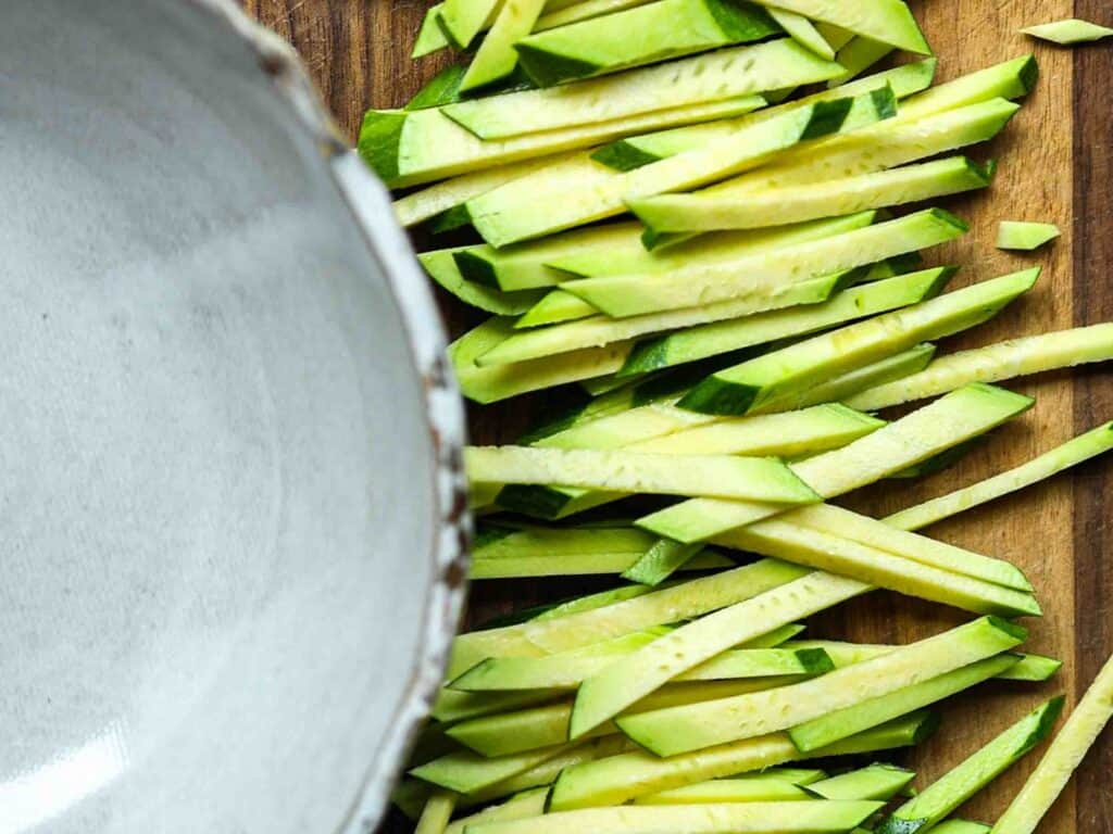 5 Easy Korean Zucchini Recipes (Banchan Side Dishes). 15 Julienned-zucchini-about-to-be-placed-into-bowl