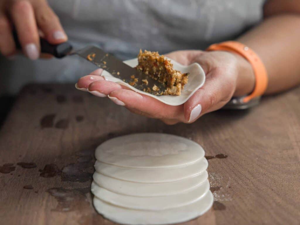 Homemade Vegan Dumplings Recipe - Kimchi Mandu. 18 adding-filling-to-dumpling-wrapper