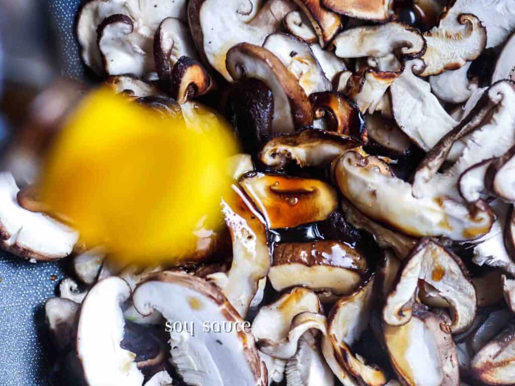 Homemade Vegan Dumplings Recipe - Kimchi Mandu. 7 adding-soy-sauce-to-mushrooms-in-pan-for-vegan-dumplings-recipe