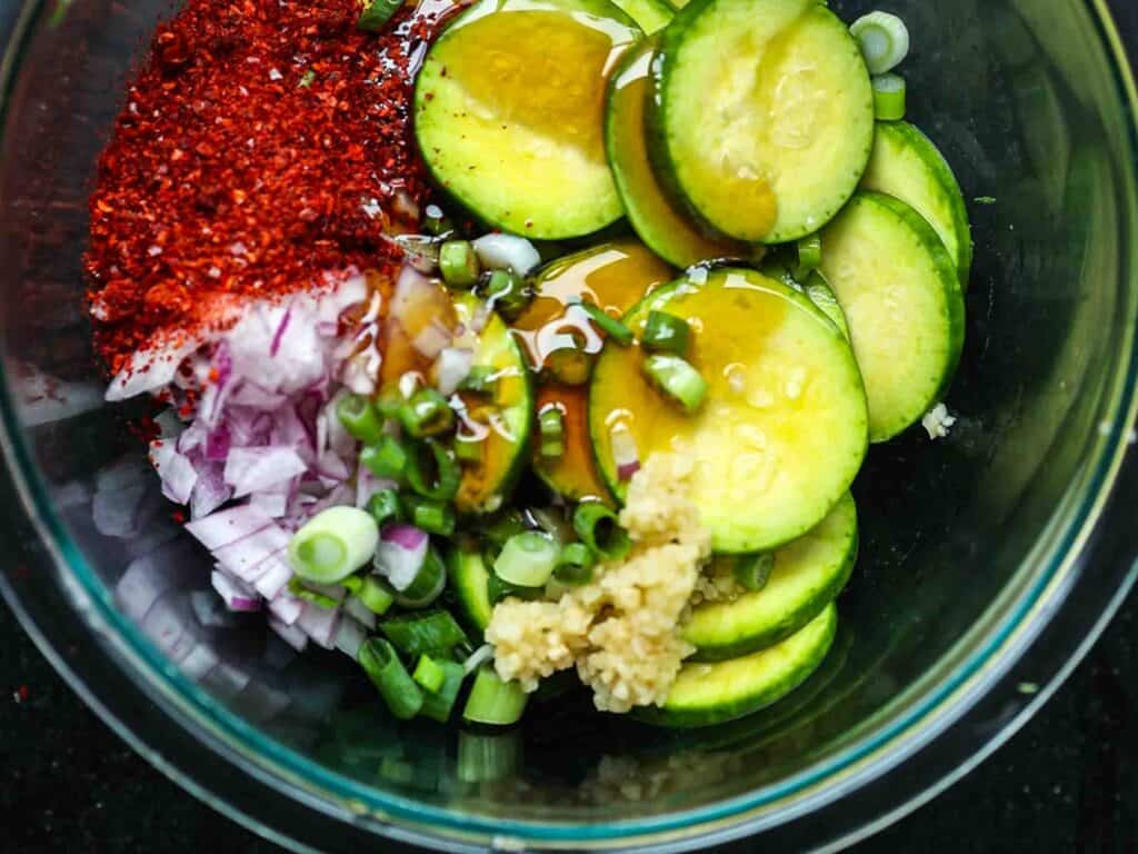 5 Easy Korean Zucchini Recipes (Banchan Side Dishes). 13 all-ingredients-for-korean-zucchini-kimchi-in-bowl