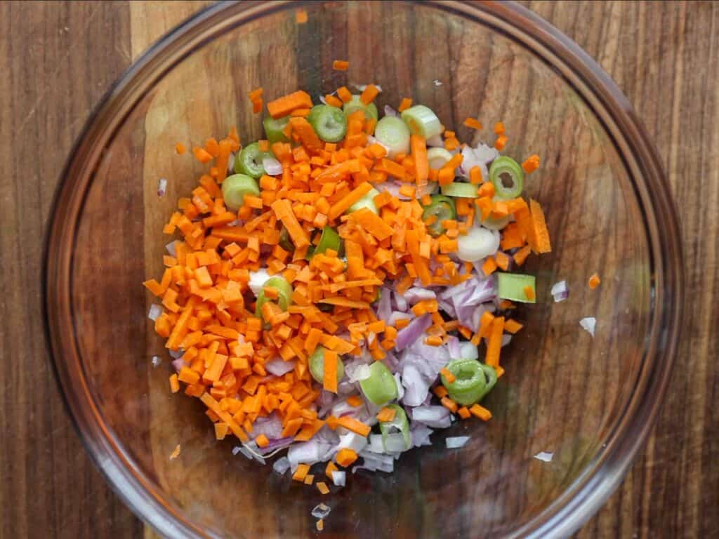 15-Minute Spicy & Cold Bibim Kimchi Noodles Recipe. 9 bowl-of-diced-carrot-green-onion-and-red-onion-