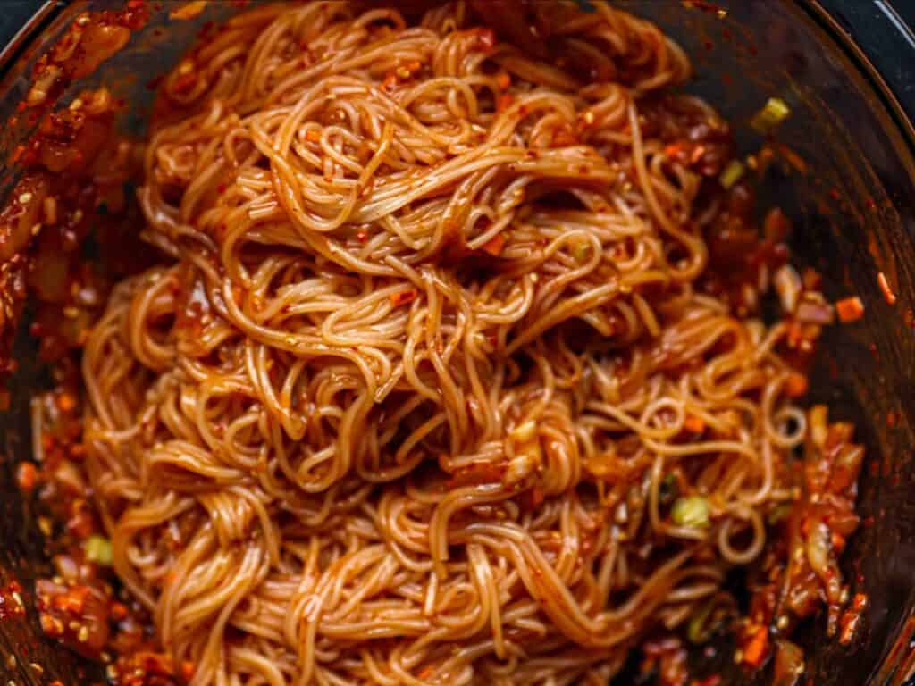 15-Minute Spicy & Cold Bibim Kimchi Noodles Recipe. 2 close-up-shot-of-mixed-kimchi-noodles-scaled