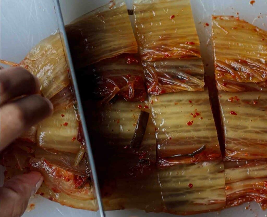 15-Minute Spicy & Cold Bibim Kimchi Noodles Recipe. 5 cutting kimchi for kimchi noodles