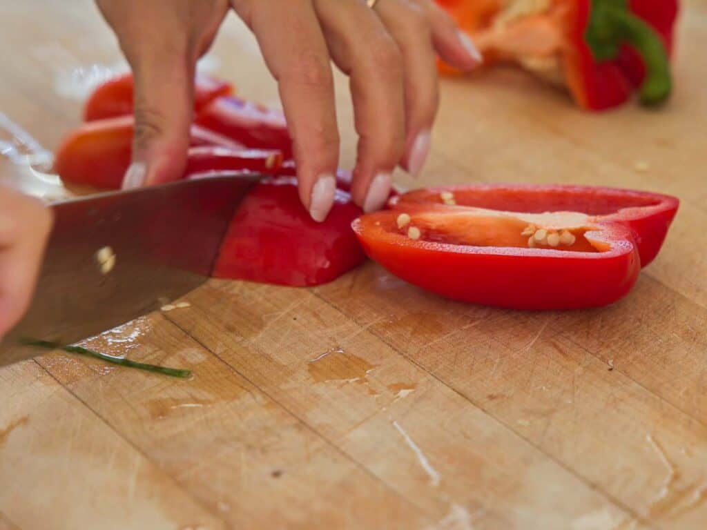Homemade Vegan Dumplings Recipe - Kimchi Mandu. 5 cutting-red-bell-pepper-for-vegan-dumplings-recipe