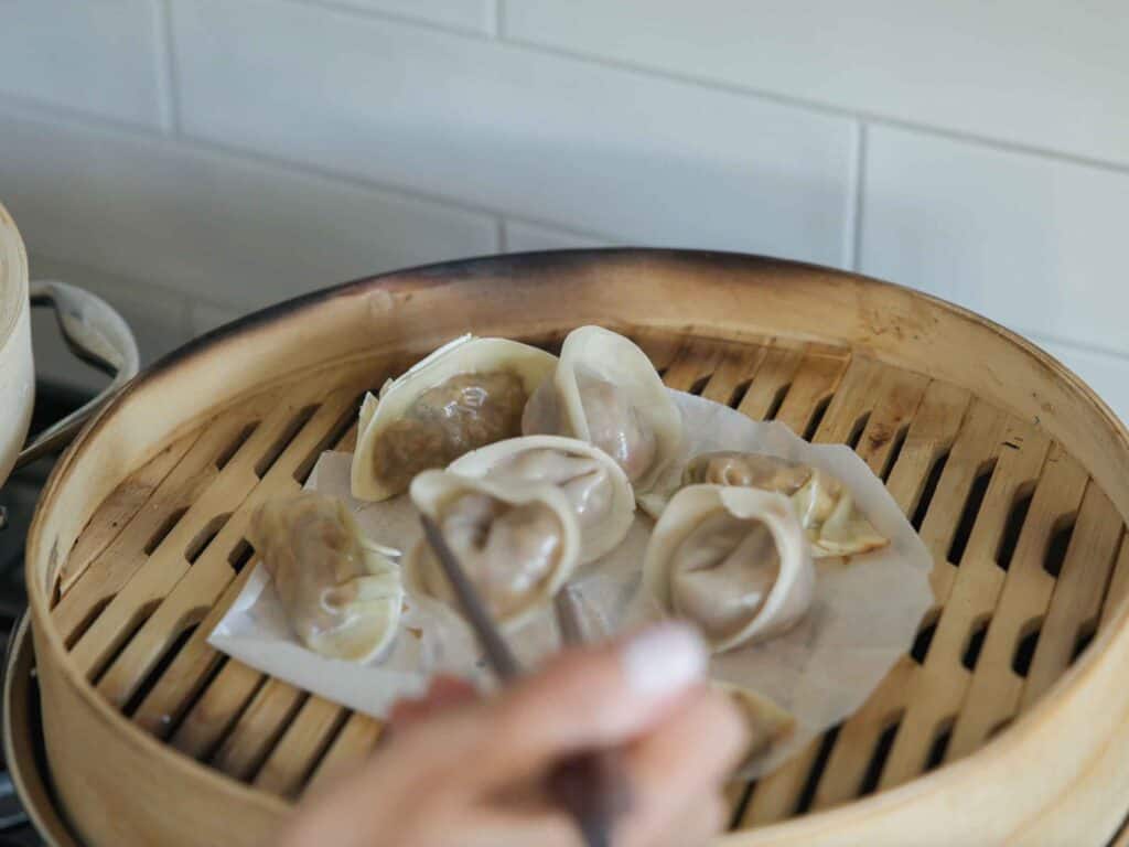 Homemade Vegan Dumplings Recipe - Kimchi Mandu. 39 finished-steamed-dumplings-in-steamer