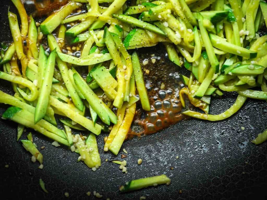 5 Easy Korean Zucchini Recipes (Banchan Side Dishes). 16 julienned-zucchini-for-korean-zucchini-banchan-cooking-in-pan