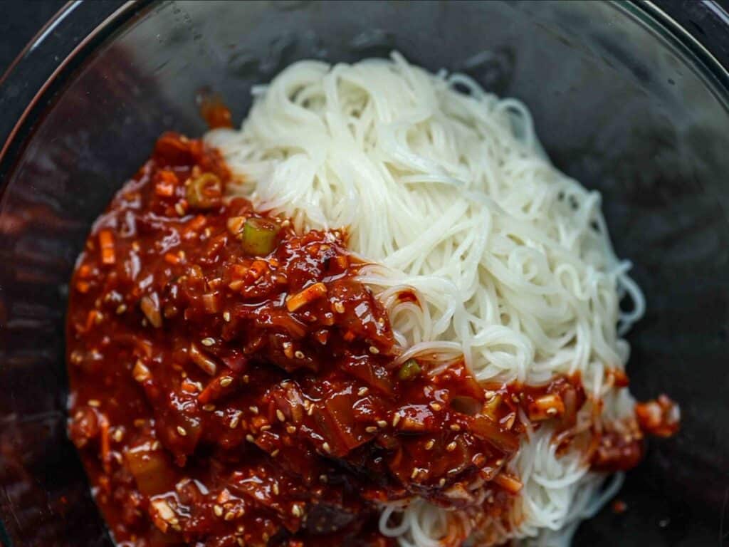 15-Minute Spicy & Cold Bibim Kimchi Noodles Recipe. 12 noodles-with-kimchi-sauce-on-top-