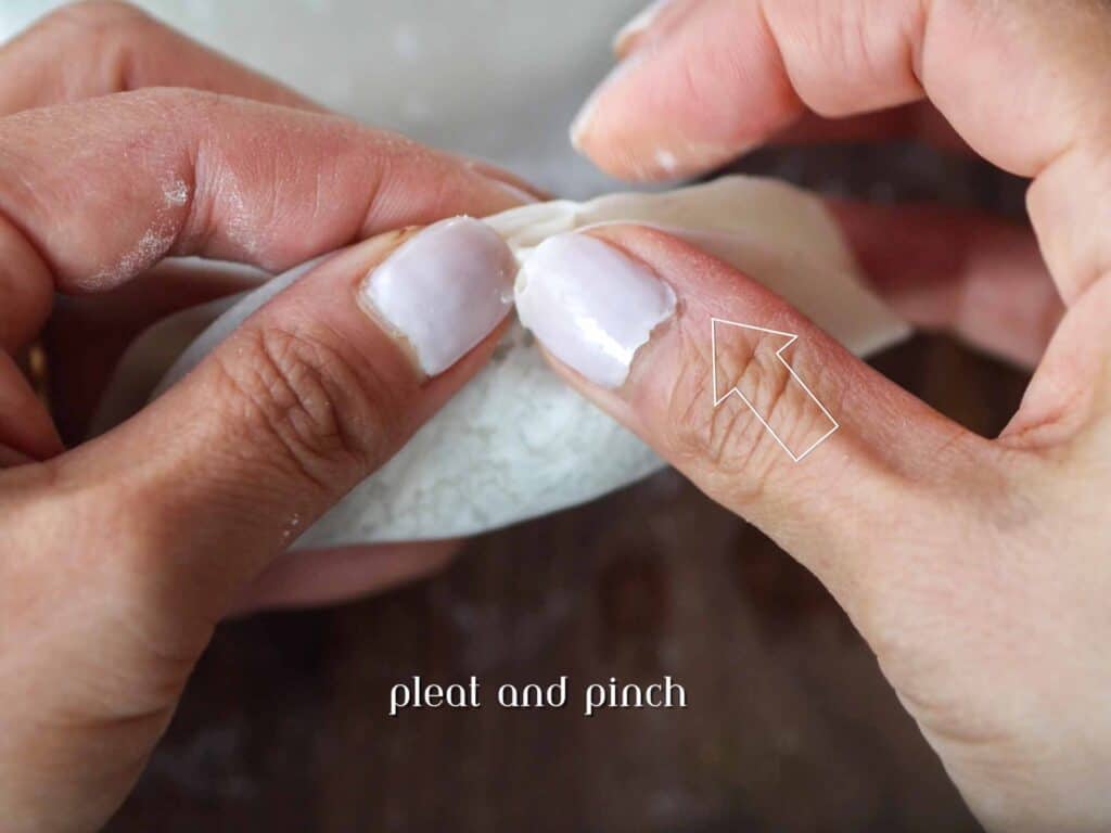 Homemade Vegan Dumplings Recipe - Kimchi Mandu. 26 pinching-the-pleat-of-dumpling