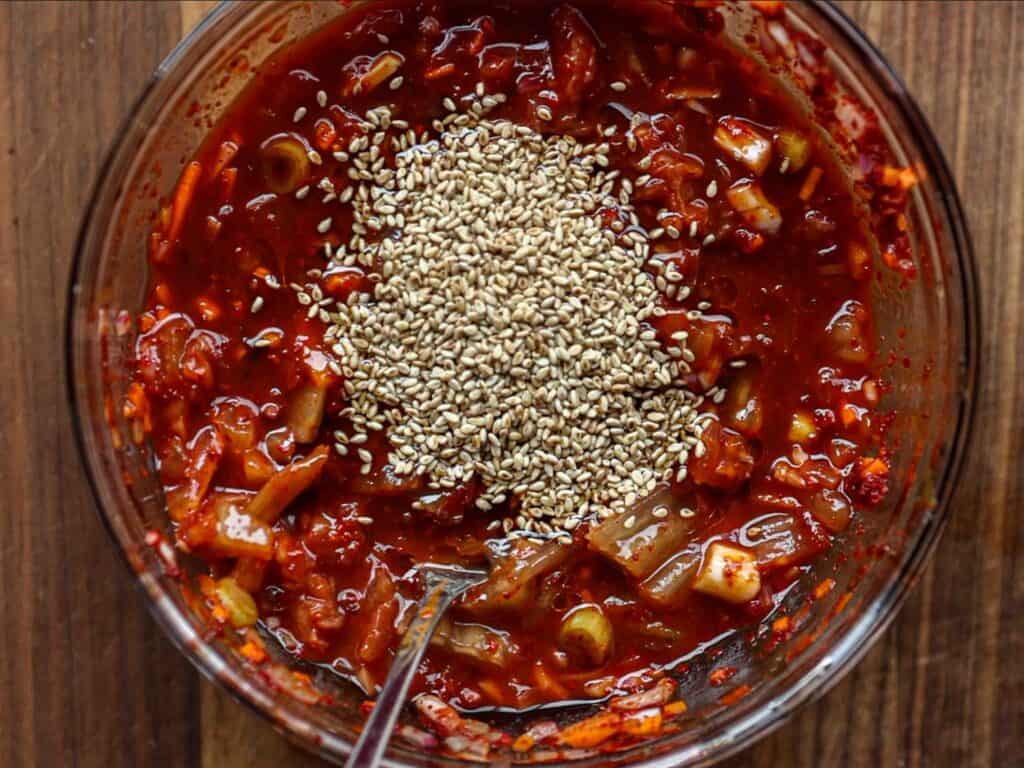 15-Minute Spicy & Cold Bibim Kimchi Noodles Recipe. 11
sauce-for-kimchi-noodles-with-sesame-seeds-scaled