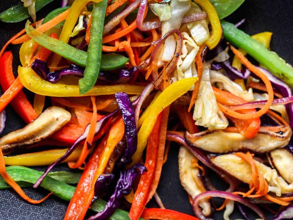 Healthy And Easy Vegan Japchae (Korean Glass Noodles). 5 stir fried bell peppers cabbage and mushrooms