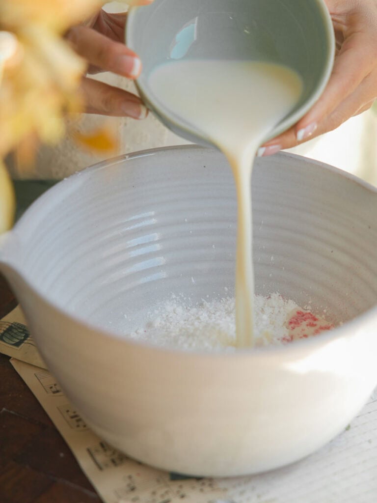 Perfect Cream Cheese & Strawberry Pink Mochi Recipe. 12 pouring milk into pink mochi batter