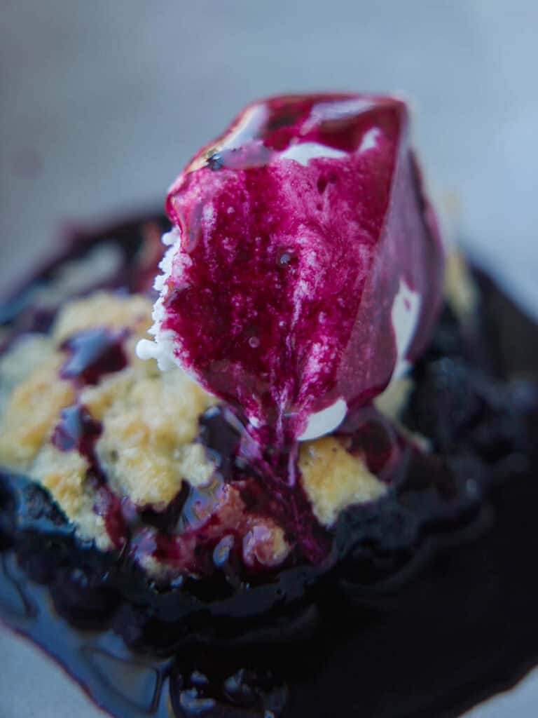 Easy Vegan Blueberry Cobbler (Gluten-Free Option!) 2 blueberry-syrup-on-top-of-ice-cream-on-vegan-blueberry-cobbler