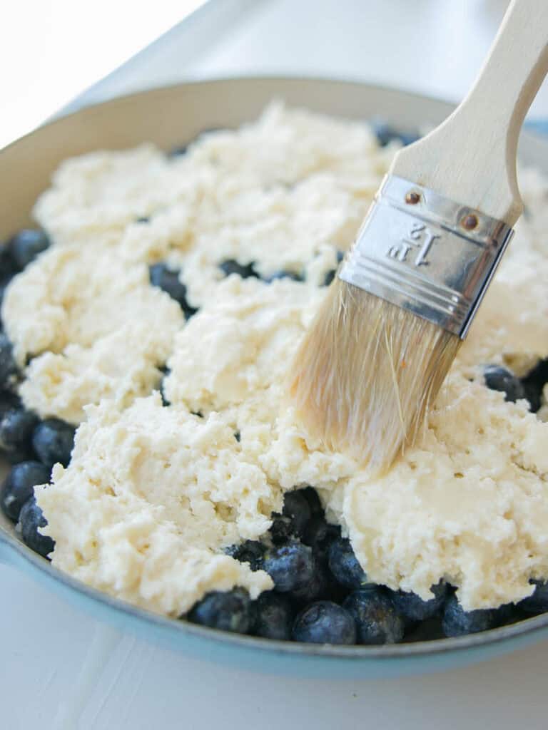 Easy Vegan Blueberry Cobbler (Gluten-Free Option!) 19 brushing-vegan-wash-on-top-of-vegan-blueberry-cobbler