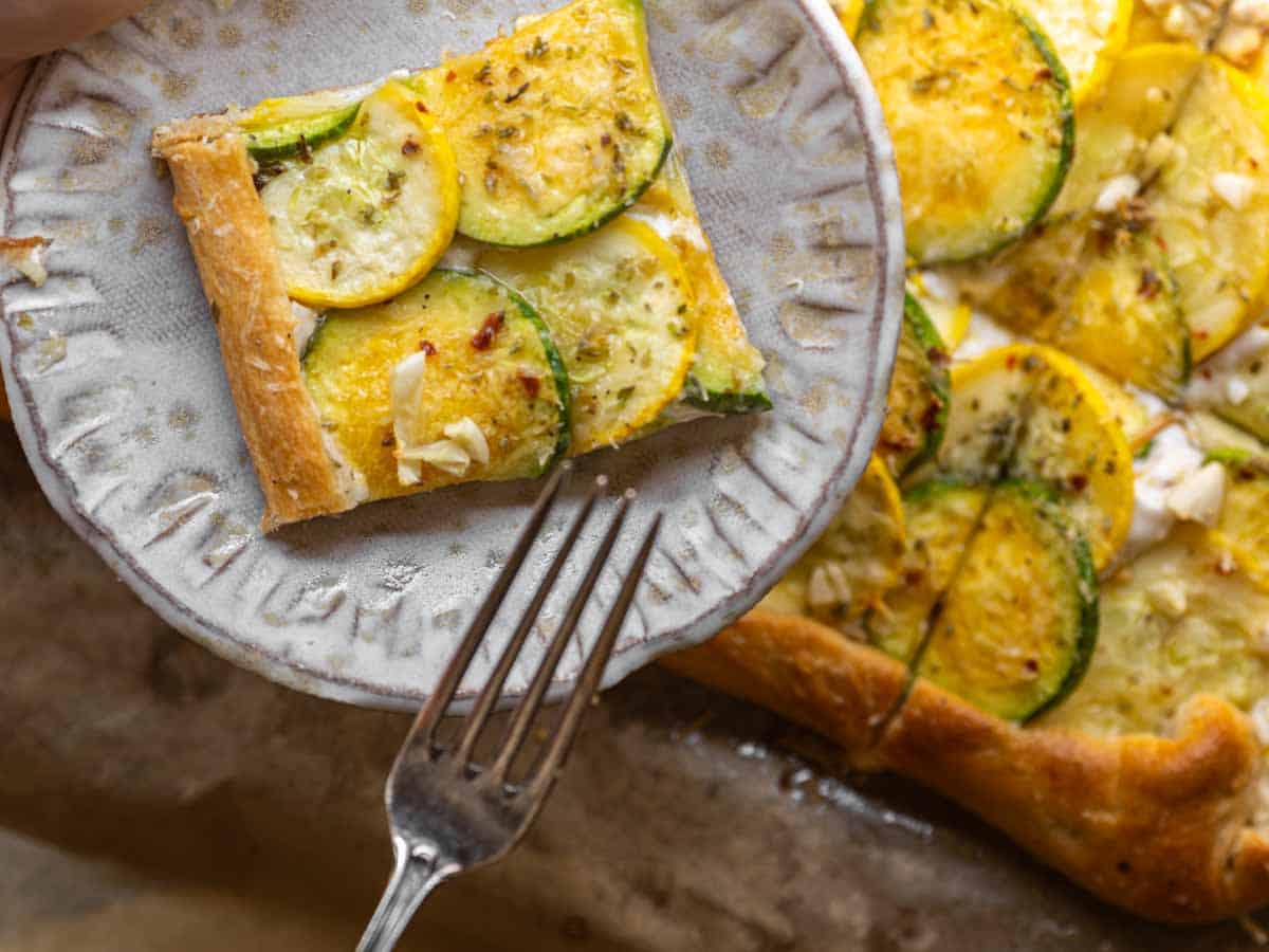 6-Ingredient BEST No-Bake Pumpkin Cheesecake (Vegan). 13 close up shot of piece of zucchini tart with fork