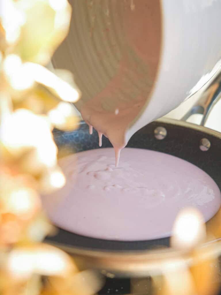 Perfect Cream Cheese & Strawberry Pink Mochi Recipe. 14 pouring pink mochi batter into pan