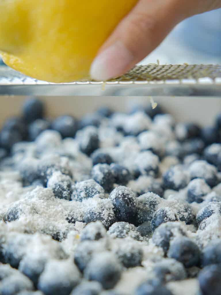 Easy Vegan Blueberry Cobbler (Gluten-Free Option!) 8 zesting-lemon-into-blueberries