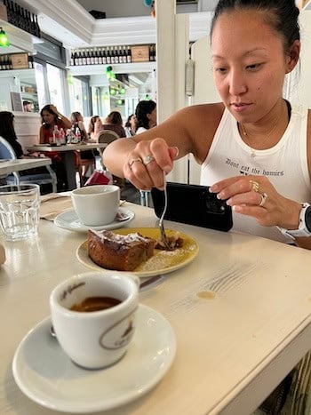 Traveling as a Vegan in Italy: An Easy & Delicious Guide. 6 Joanne having dessert at RosemaryTerra e Sapori.