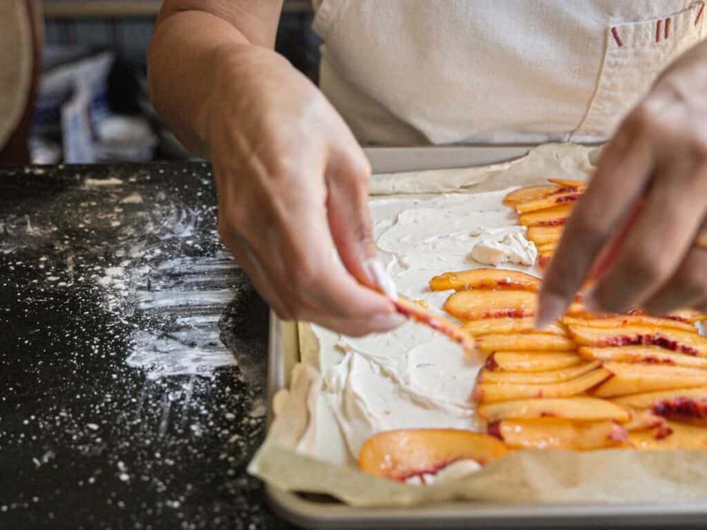 6-Ingredient Easy Cream Cheese Peach Galette Recipe. 16 arranging-peach-slices-onto-peach-galette