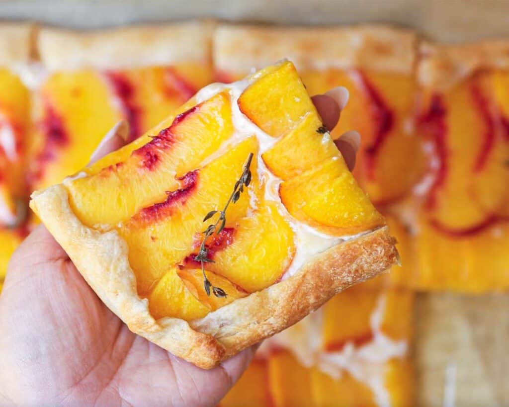 6-Ingredient Easy Cream Cheese Peach Galette Recipe. 22 close-up-shot-of-baked-peach-galette-piece