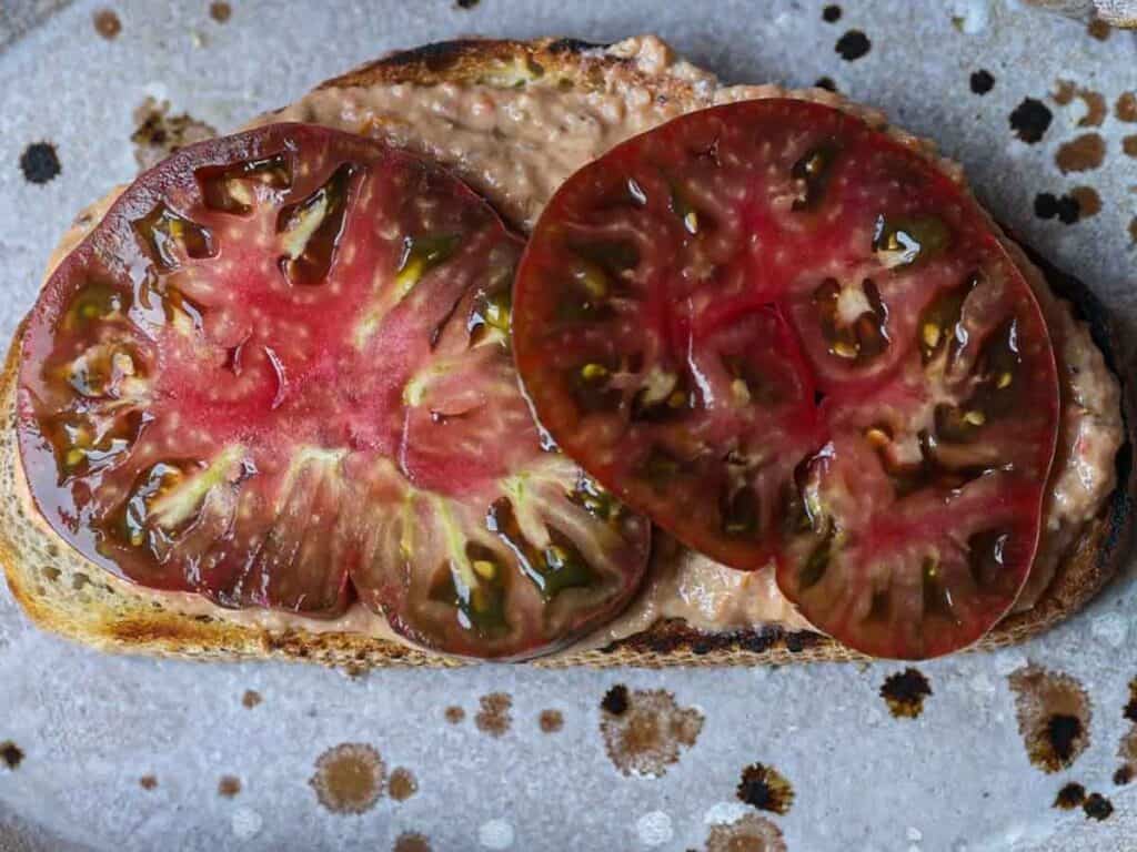 DELICIOUS Hi-Protein Vegan Mediterranean Toast Recipe. 13 heirloom-tomatoes-on-toast.j