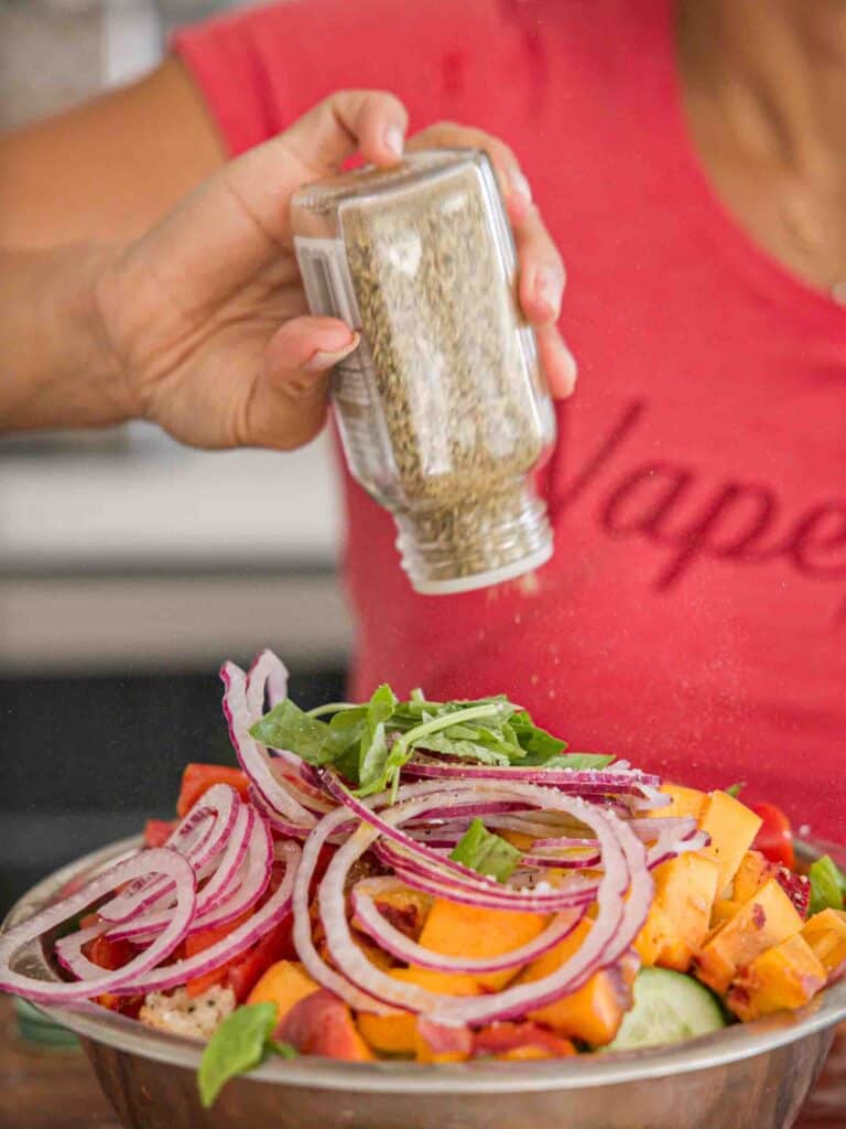 10-Minute Easy Bread Salad Recipe - Peach Panzanella. 17 adding-italian-seasoning-to-bread-salad